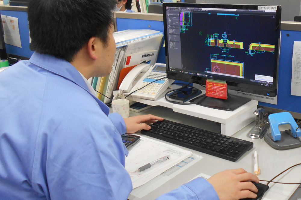 A saff member working on a computer.